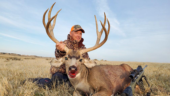 Hunter with large Mule Deer in Idaho
