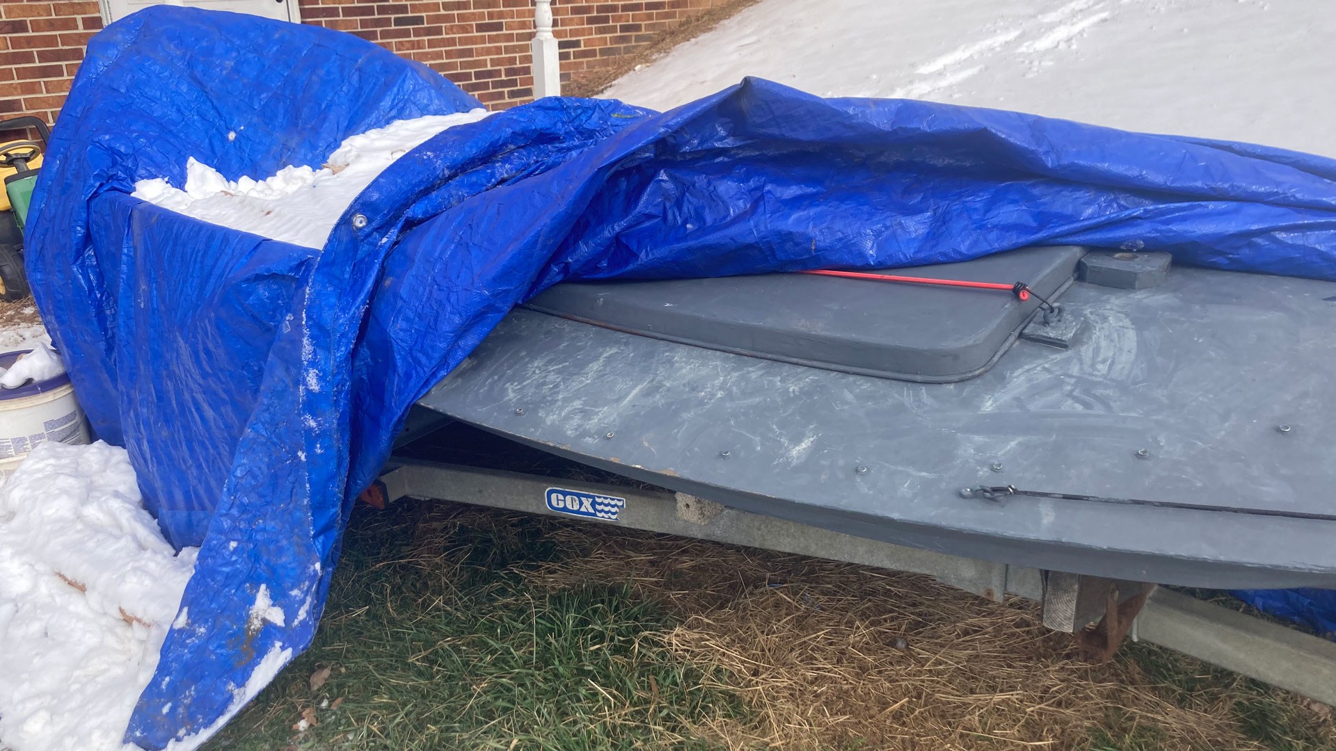 Boat under tarp