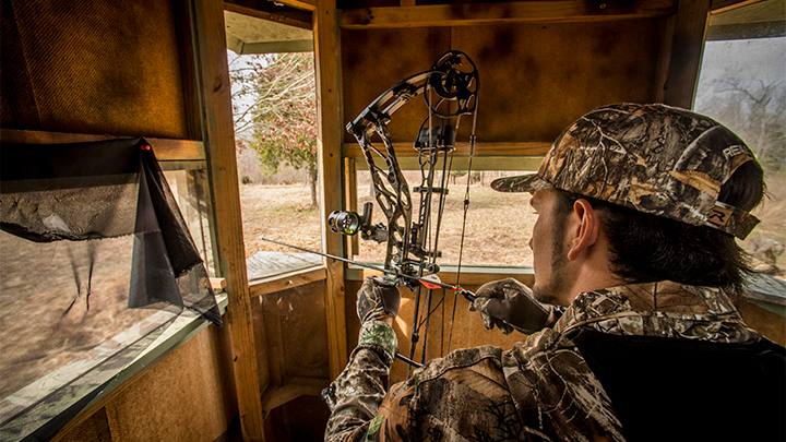 Bowhunter in Box Blind