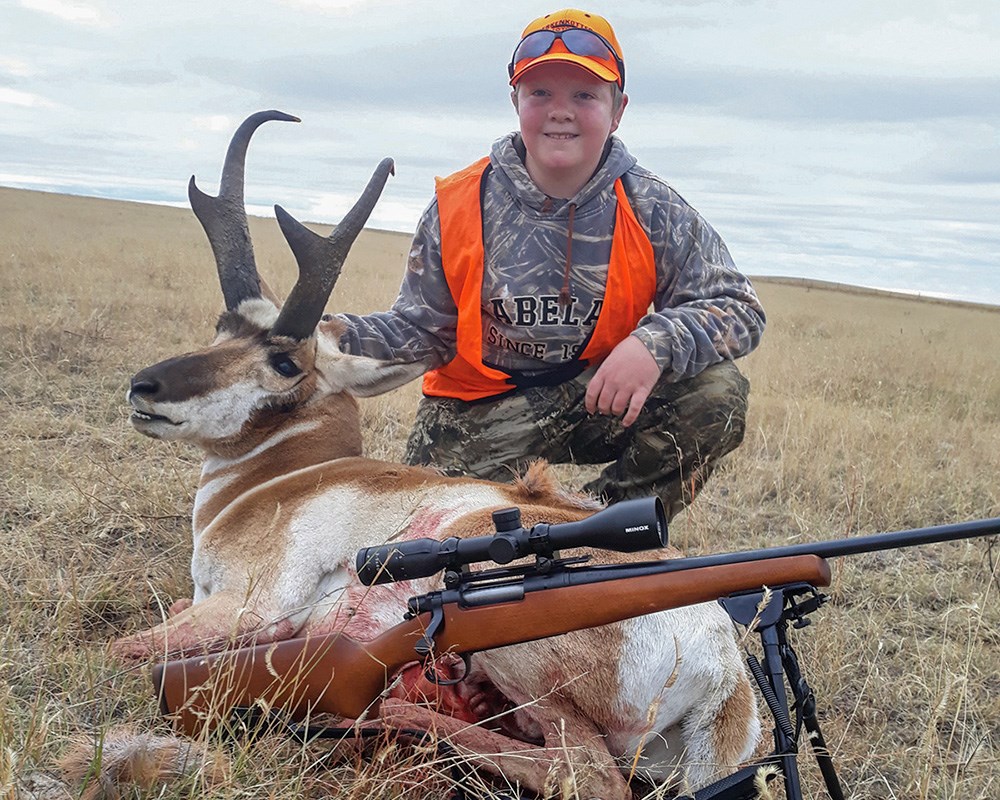 Young male hunter with pronghorn antelope.