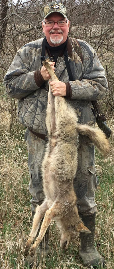 Roux holding coyote