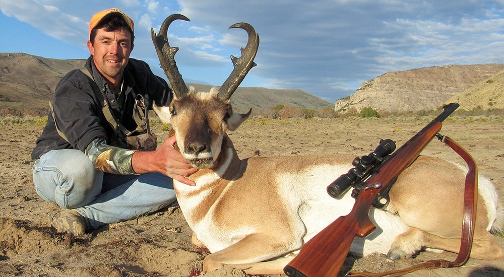 Male hunter with pronghorn antelope in Utah
