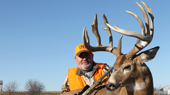 Hunter with 200-Inch Whitetail Buck