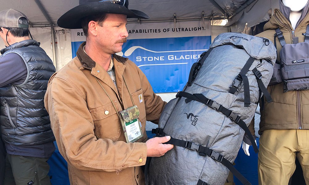 Man Examining Stone Glacier Terminus 7000 Hunting Pack