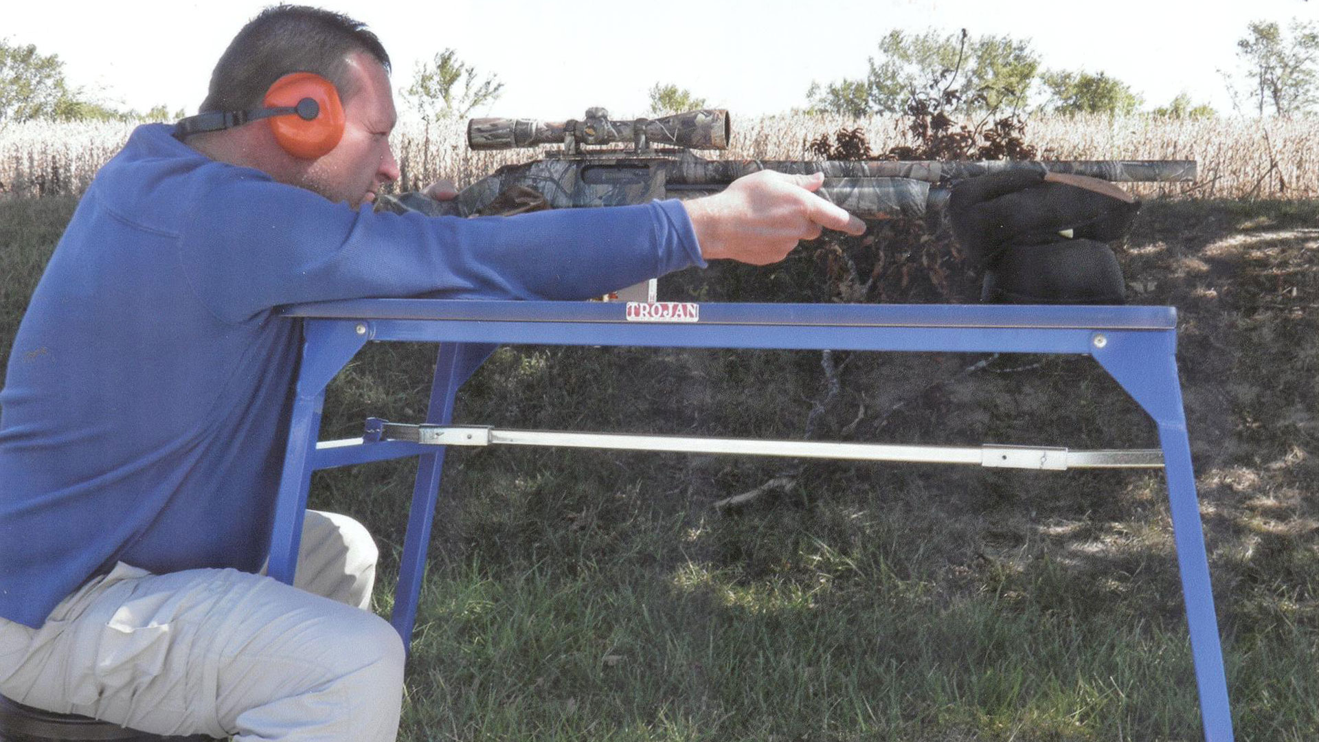 Man shooting off table.