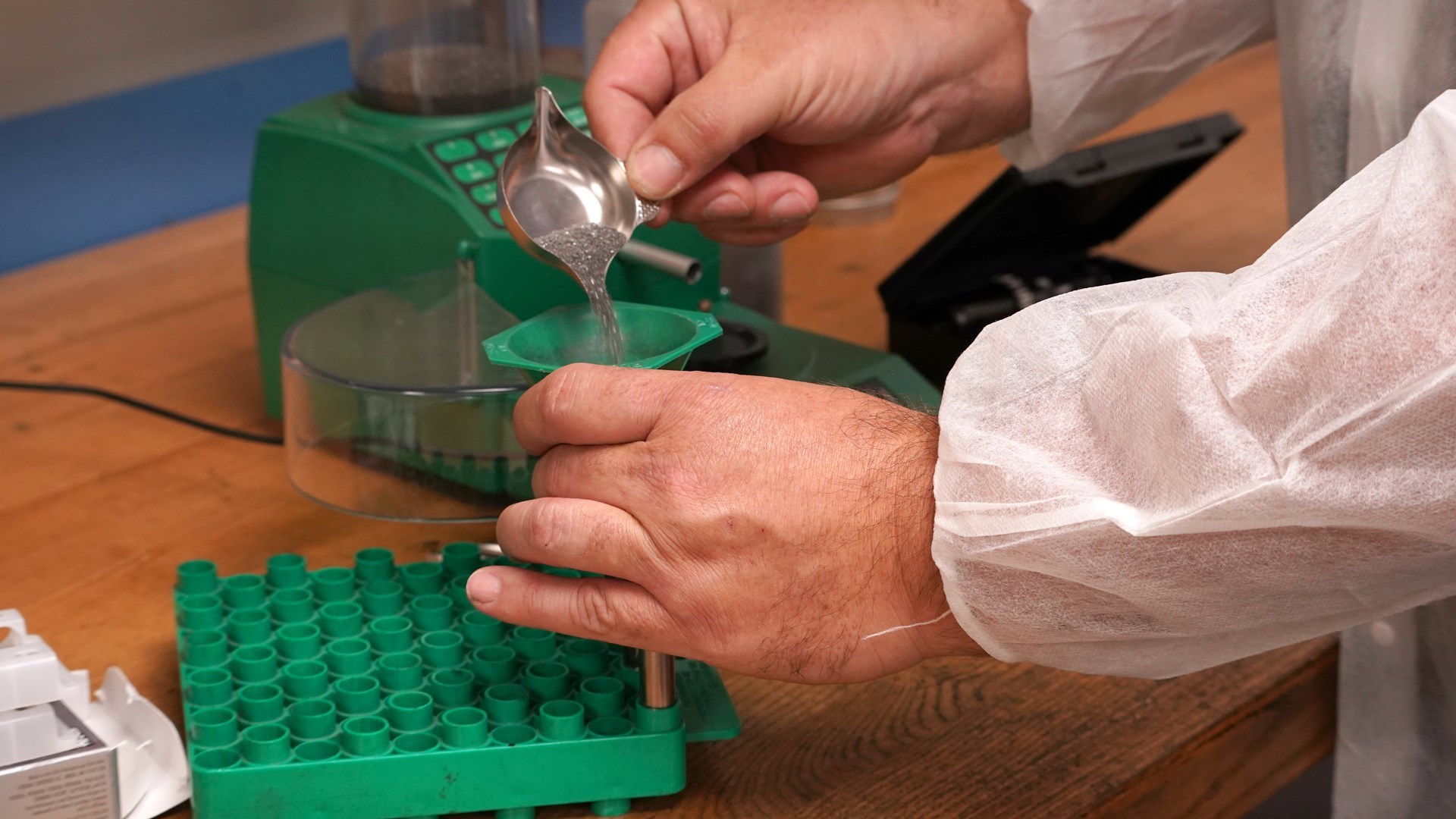 7mm Backcountry loading at bench closeup of powder funnel measuring
