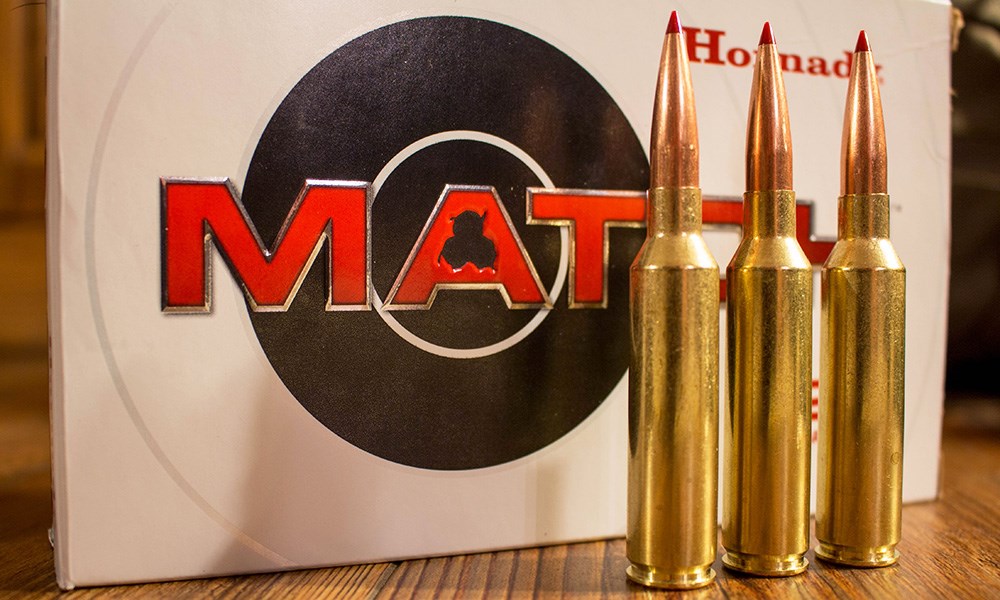 Hornady 7mm Precision Rifle Cartridges standing upright in front of Match ammunition box.