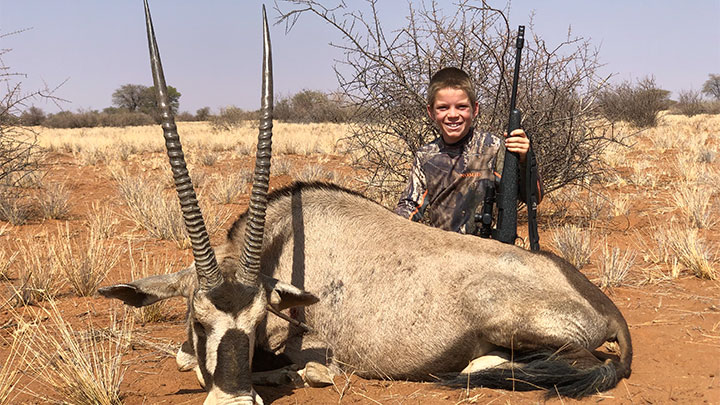 Hunter with gemsbok