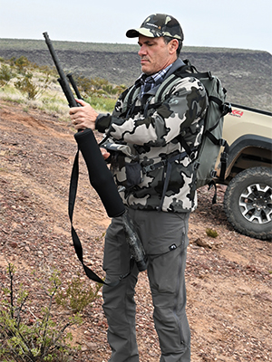 Hunter preparing rifle before sheep hunt