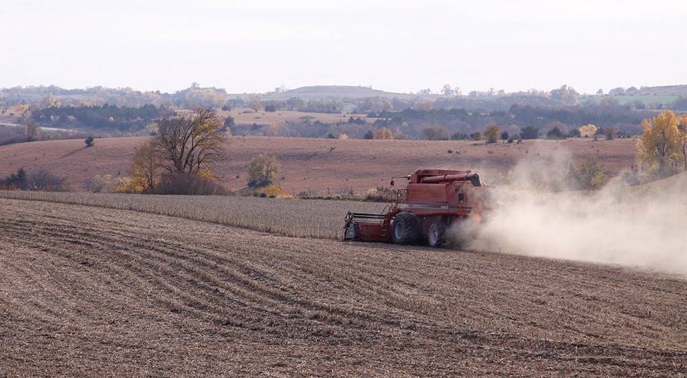 Tractor plowing an open field in Iowa.