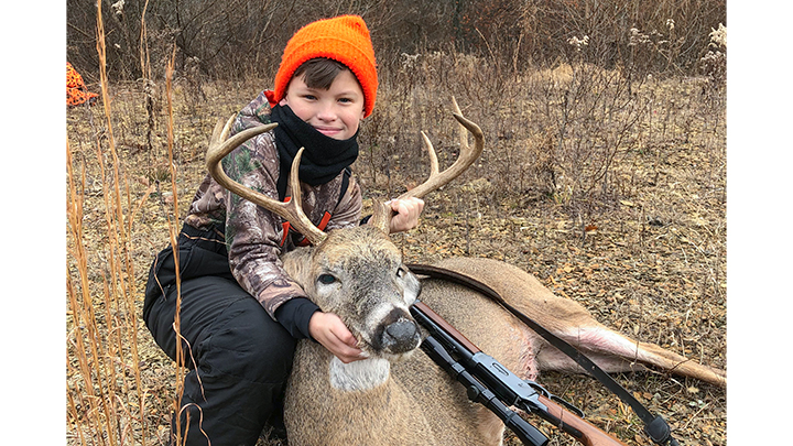 Young hunter with buck taken with .30-30 Winchester
