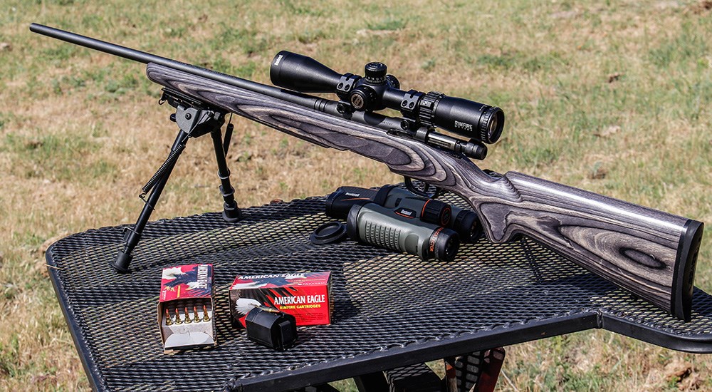 Rimfire rifle with .17 WSM ammunition on outdoor shooting bench.