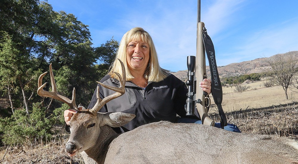 Female hunter posing with Coues deer.