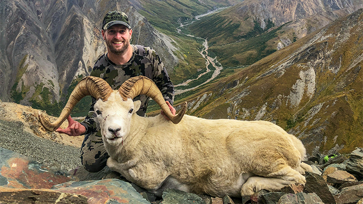 Hunter with Dall Sheep in Alaska