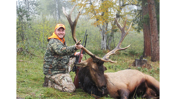 Hunter with South Dakota Black Hills bull elk