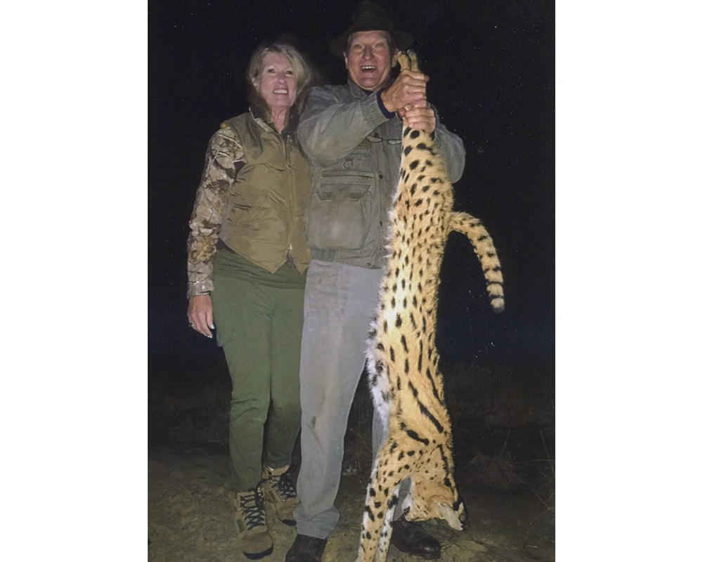 Hunters with serval in South Africa