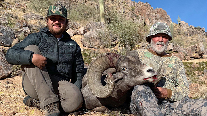 Hunter and guide with Arizona desert bighorn sheep