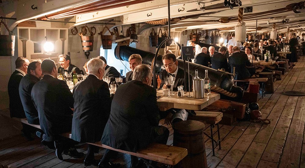 Dinner served inside of HMS Victory ship.