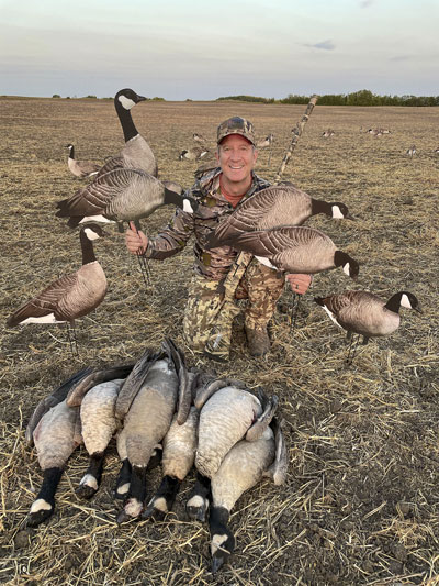 Hunter with geese