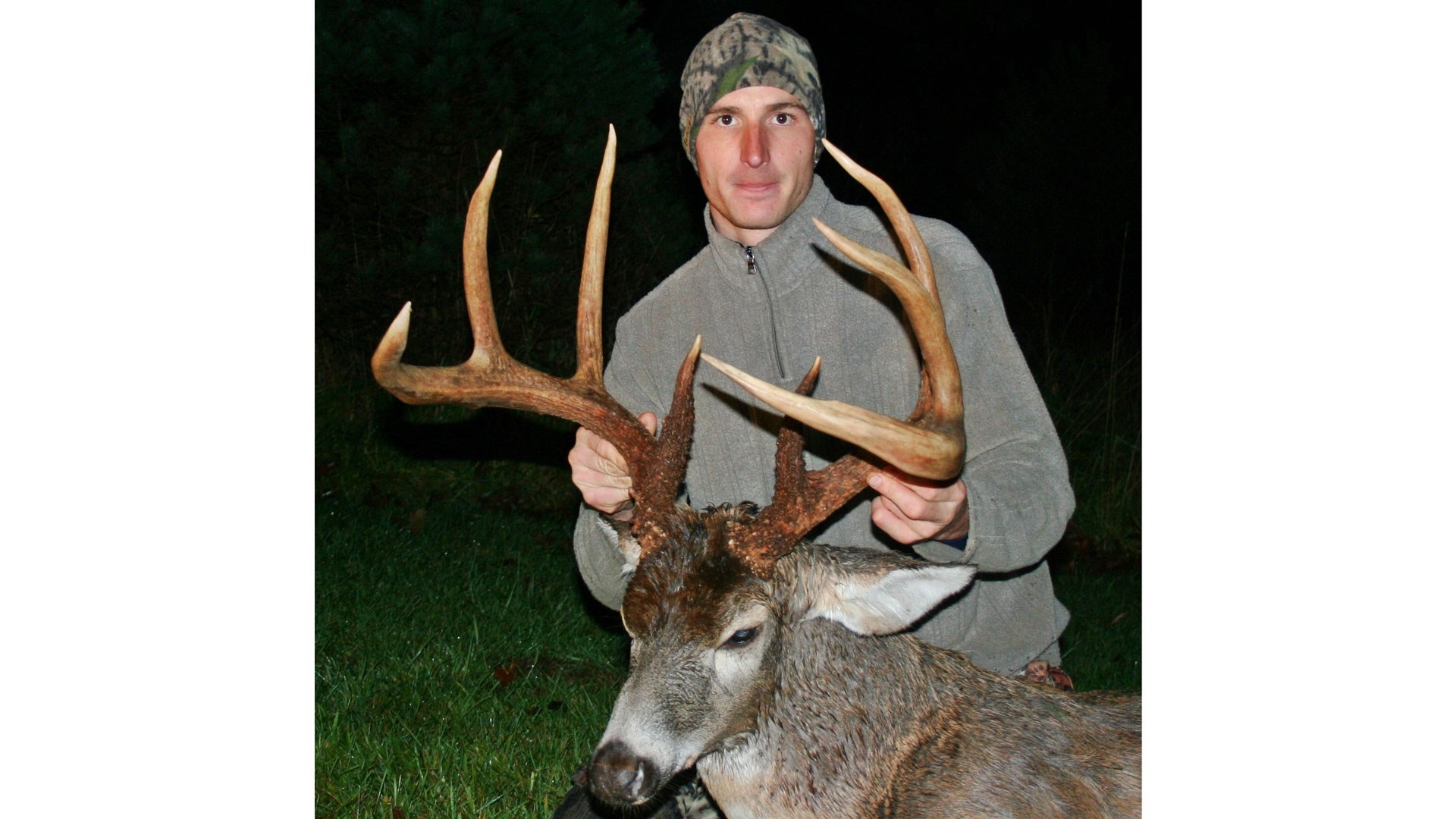 Bowhunter with deer