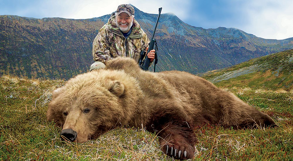 Hunter with Brown Bear