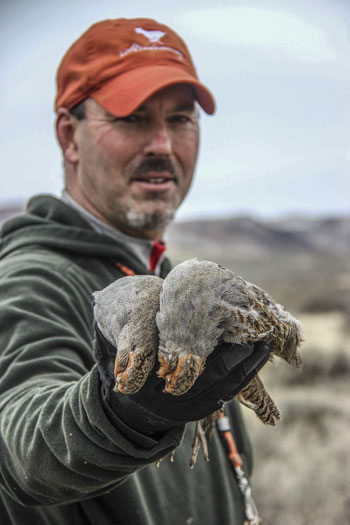 Hunter holding birds