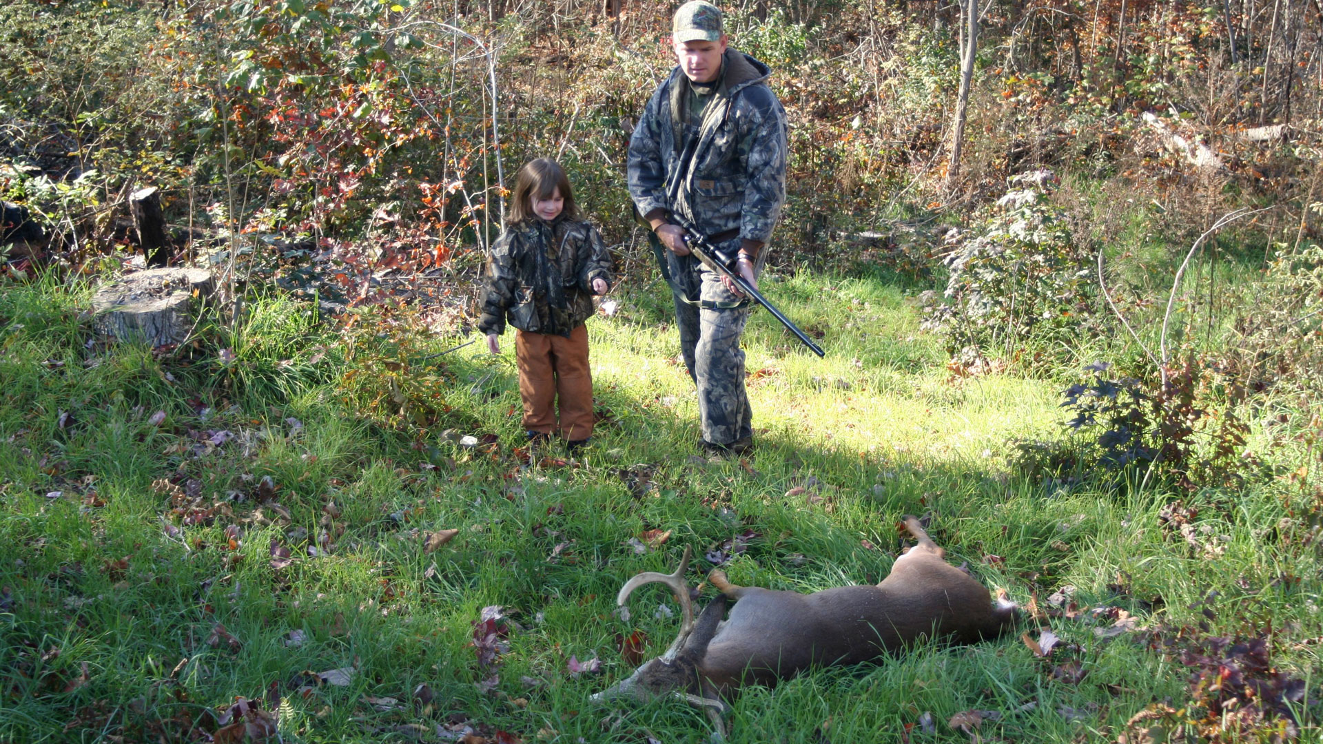Hunters Walking Up On Deer