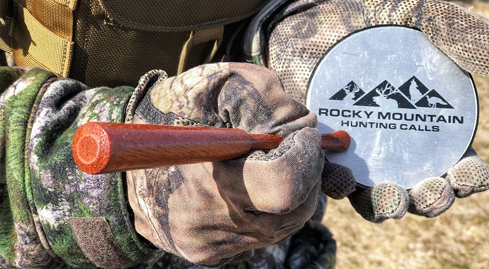 Hunter striking Rocky Mountain Hunting Calls turkey slate call.