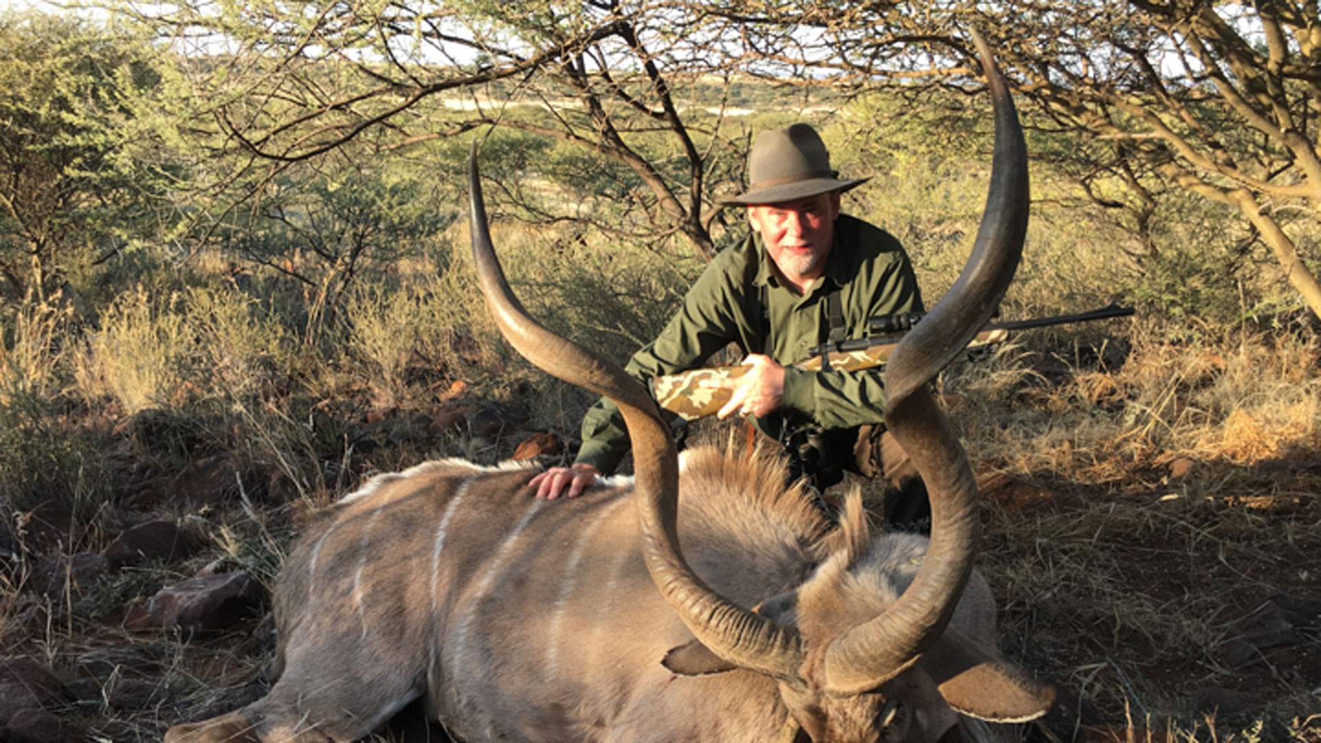 Hunter with kudu