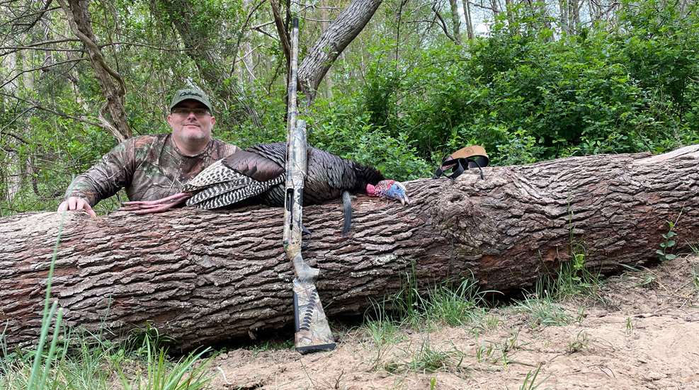 Hunter With Turkey And Shotgun