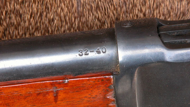 .32-40 marking on the barrel of a rifle with wood forend