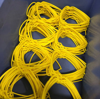 Yellow ringed personal protective gear produced by Otis in a blue box