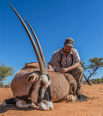 Hunter with Gemsbok in Namibia