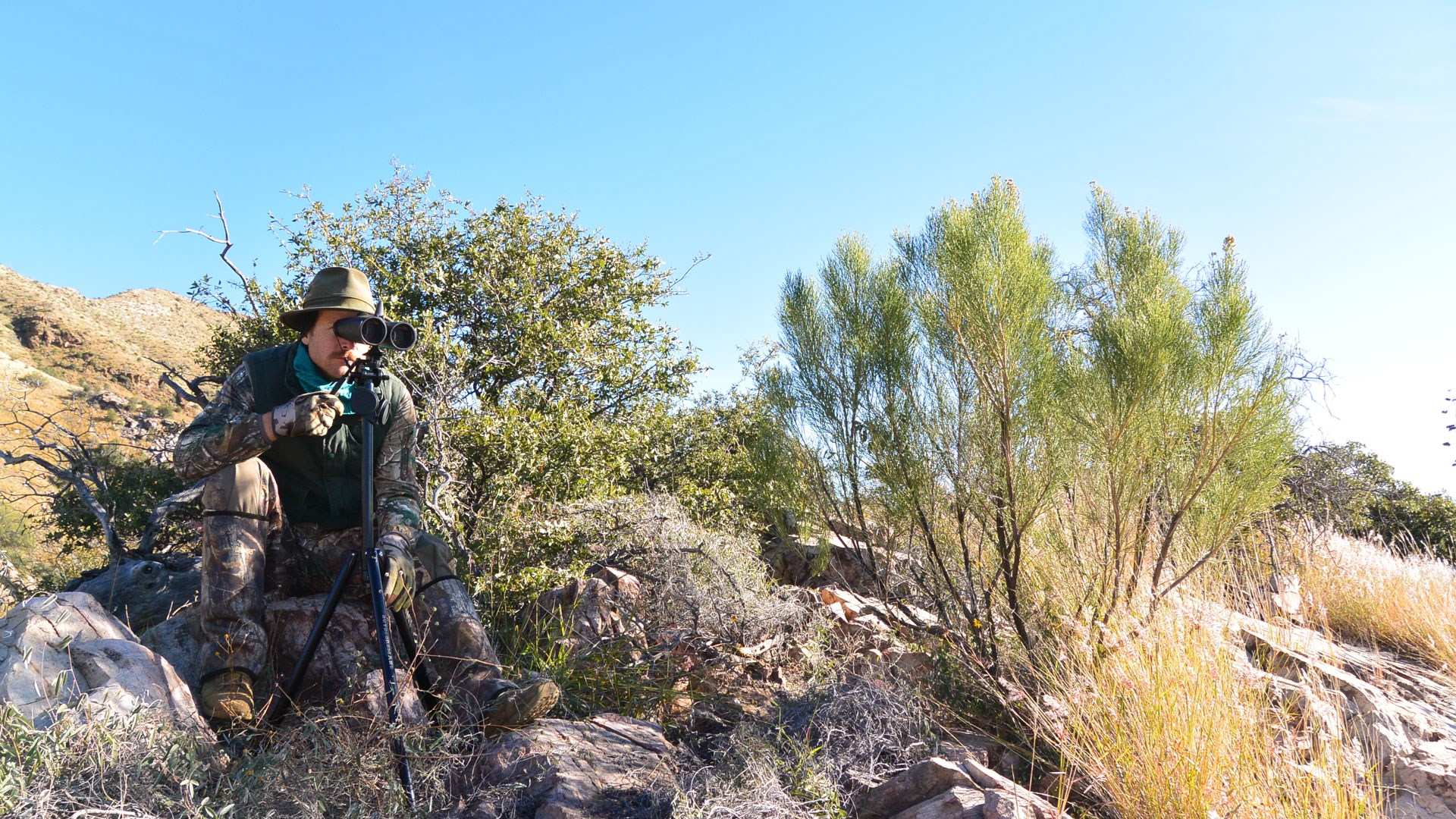 Glassing for elk on a rock pile