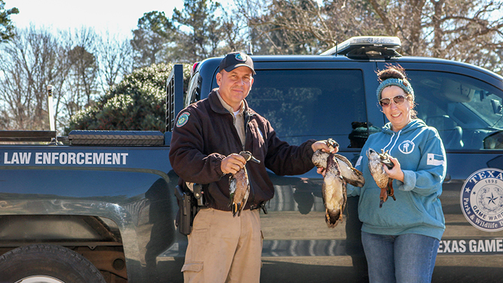 Game Warden Donating Game Bird Meat to Woman