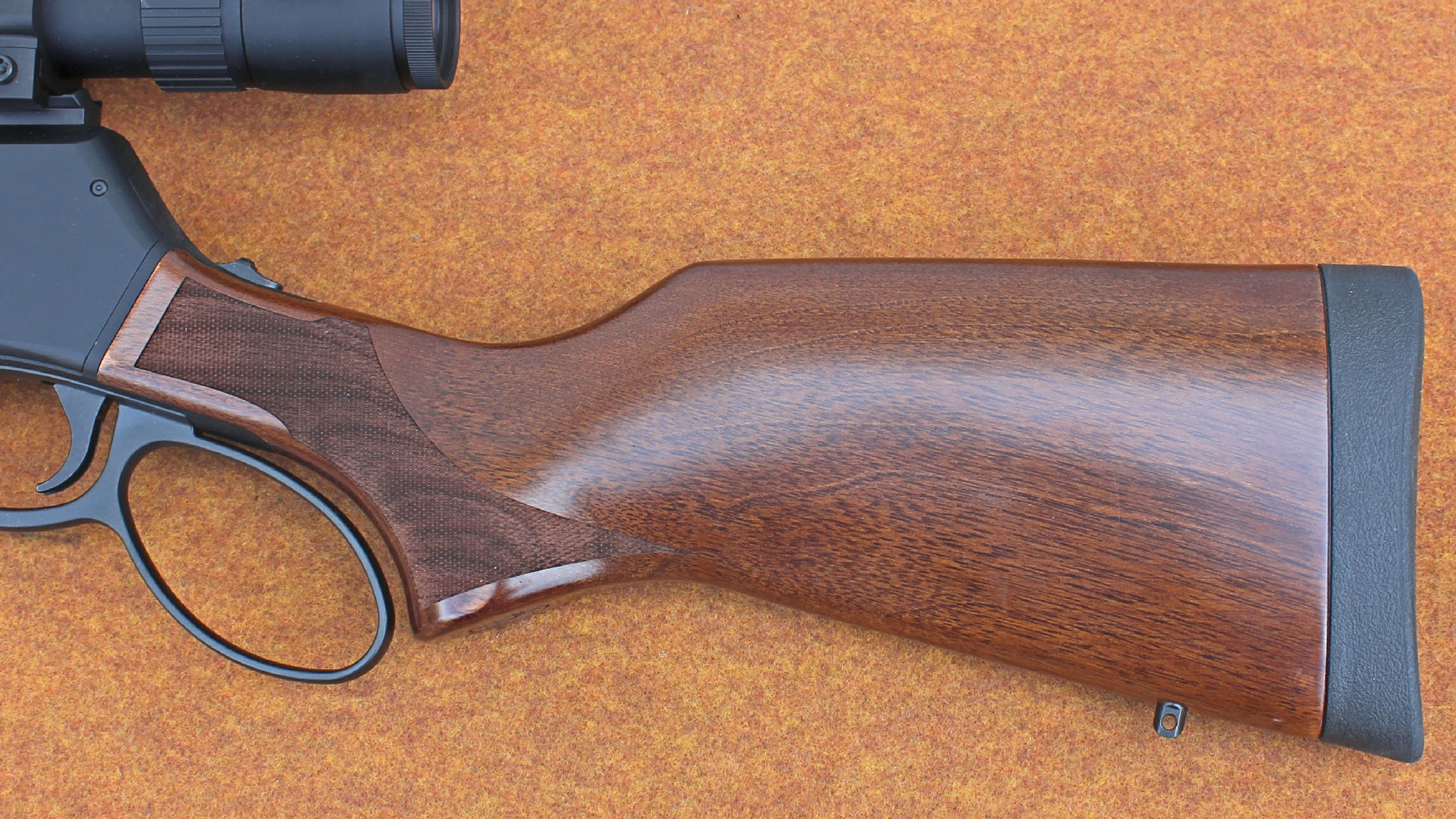 The American walnut shoulder stock provides a 14-inch length of pull and a soft rubber recoil pad.