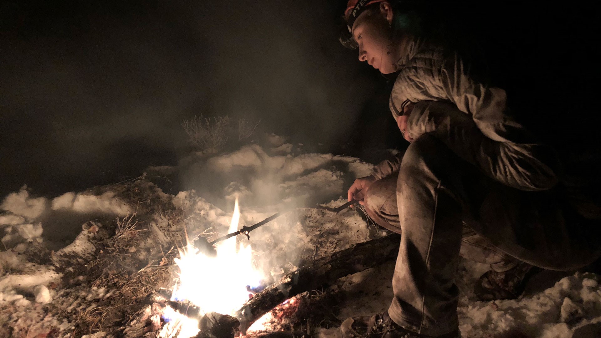 Searing meat on a stick over a fire