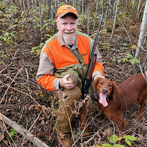 Man with Bird Hunting Dog