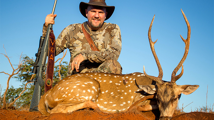 Hunter with Axis Deer Taken on the island of Molokai, Hawaii