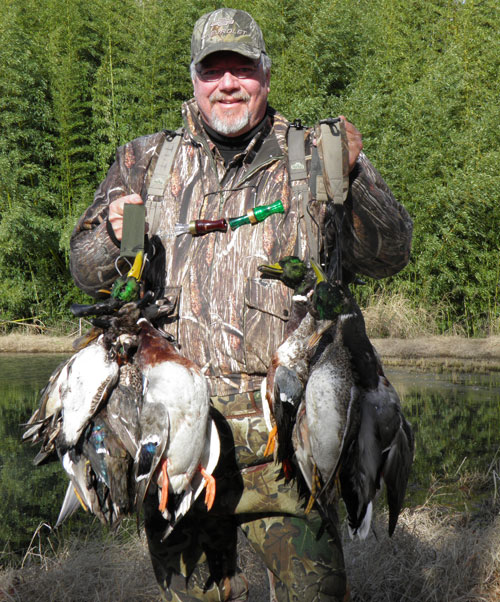 Mike Roux holding ducks