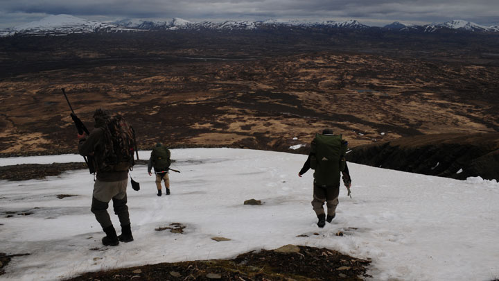 Hiking down a snow covered hill