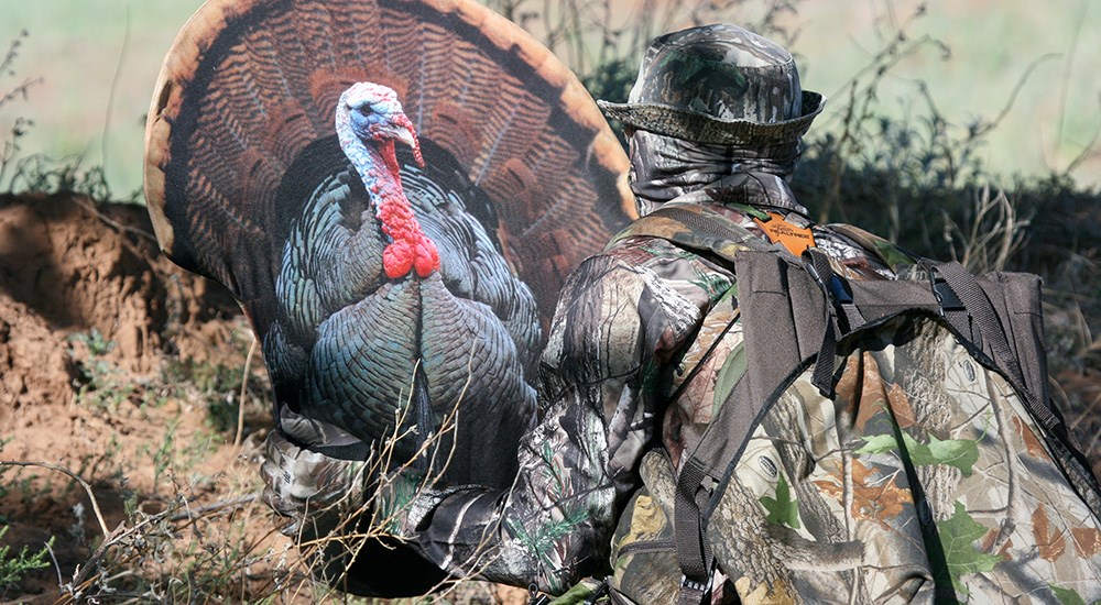 Hunter placing turkey decoy.