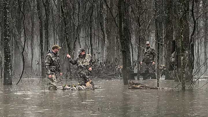 Duck Hunters Placing Decoys on Water