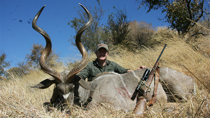 Hunter with Kudu