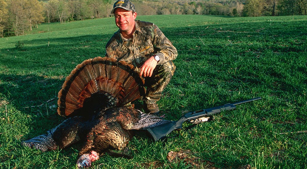 Hunter with Eastern Wild Turkey