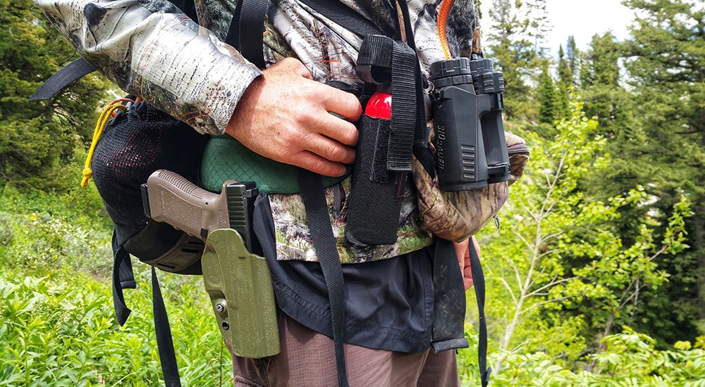 Man equipped with bear spray in case of bear encounter