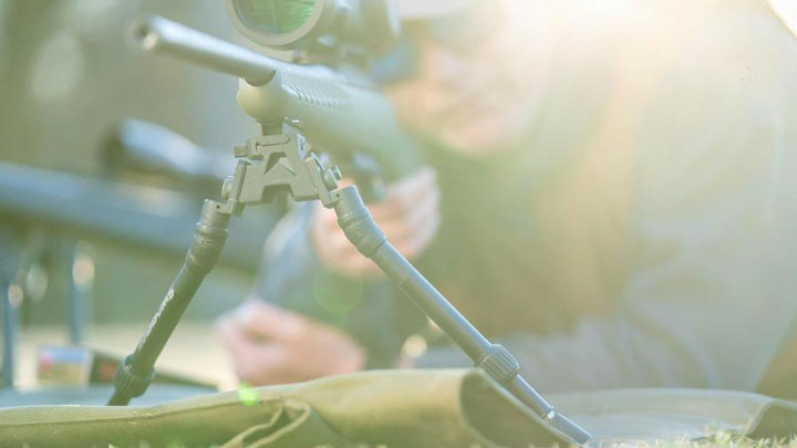 SEA12 Bipod on rifle in sunlight with shooter