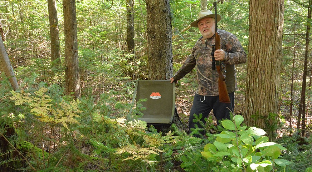 Bear Hunter in Woods