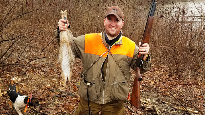 New Hunter Holding Up Rabbit