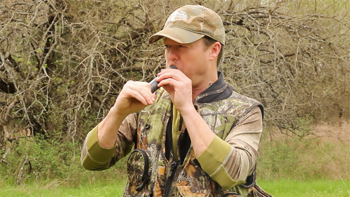 Turkey Hunter Using Owl Call to Locate Turkeys